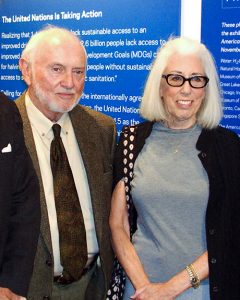 Public health advocates Sid Lerner in a brown jacket and tie and ivory shirt with Helaine Lerner in a gray dress, black jacket and eye glasses.