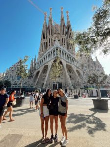 Hopkins senior women's lacrosse player Bailey Cheetham poses with two friends outside of Barcelona's Sagrada Familia cathedral