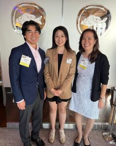 Jennifer Lee is standing in between Jason Koh, MD, and Linda Yau, MD, at their 30th class reunion. They are all smiling with Koh to the left of Lee and Yau to the right.