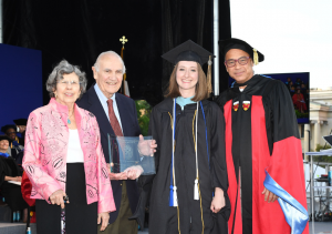 johns hopkins school of education alumni and donors saralynn and sheldon glass stand with masters student annaliese neaman and dean christopher morphew