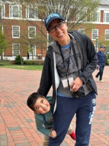 hopkins alum Melissa Lee smiles with her son, Alex, during johns hopkins reunion weekend
