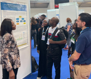 Dr. Monica Gbuchie, presenting research during the poster exhibition at the 25th International AIDS Conference (AIDS 2024) in Munich, Germany